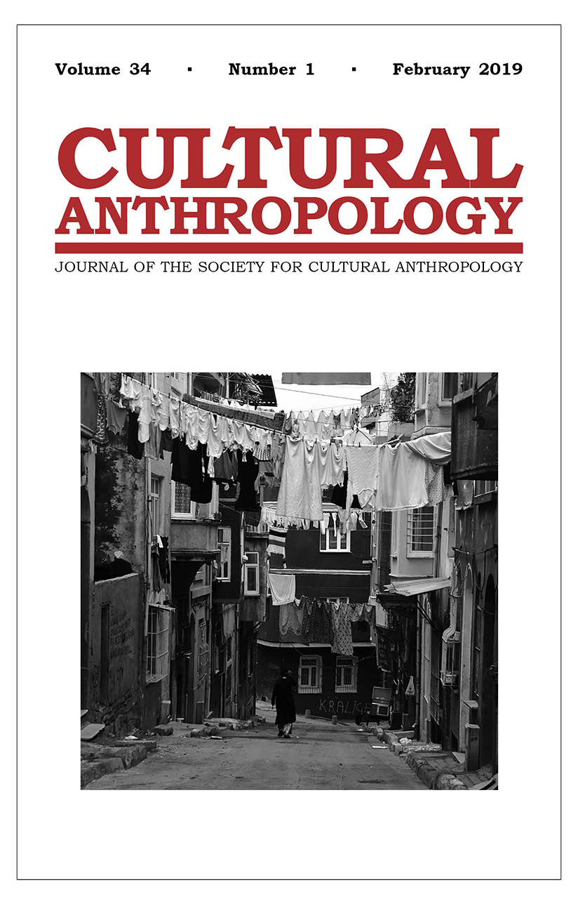 Cover of the February 2019 issue, featuring a black-and-white photo of a narrow street in Turkey.